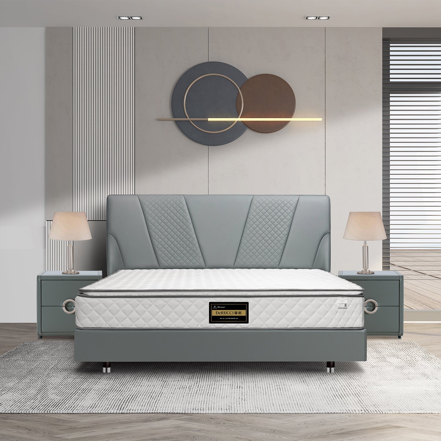Modern gray bed frame with white mattress by DeRUCCI in a stylish bedroom. Features include bedside tables with lamps and decorative wall art.