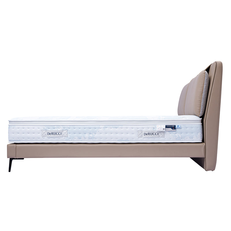 Beige leather bed frame with white DeRUCCI mattress, featuring a padded headboard for comfort