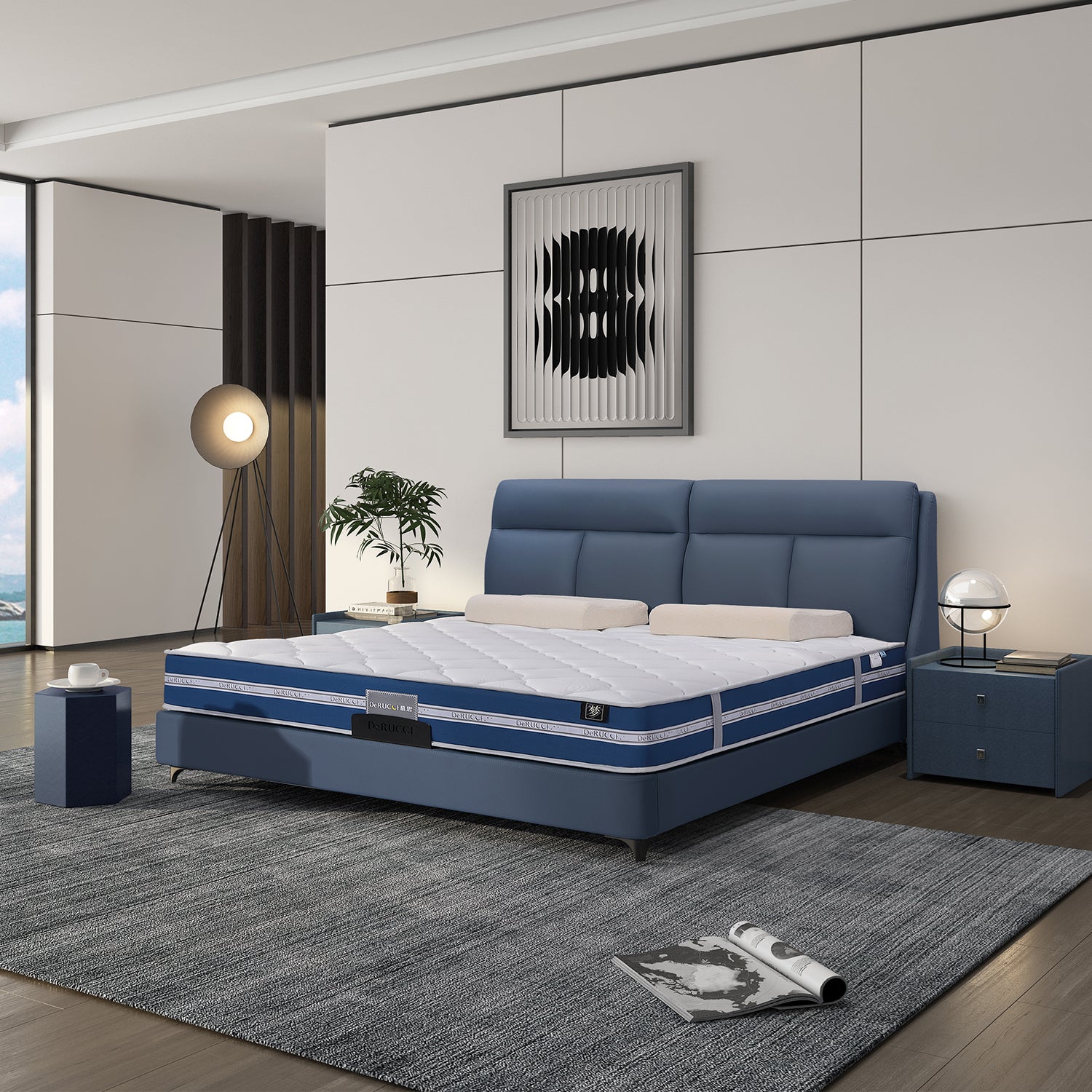 DeRUCCI Bed Frame BOC1 - 002 in blue leather with a padded headboard and white mattress, styled in a modern bedroom with a grey carpet, blue nightstand, lamp, plant, and abstract wall art.