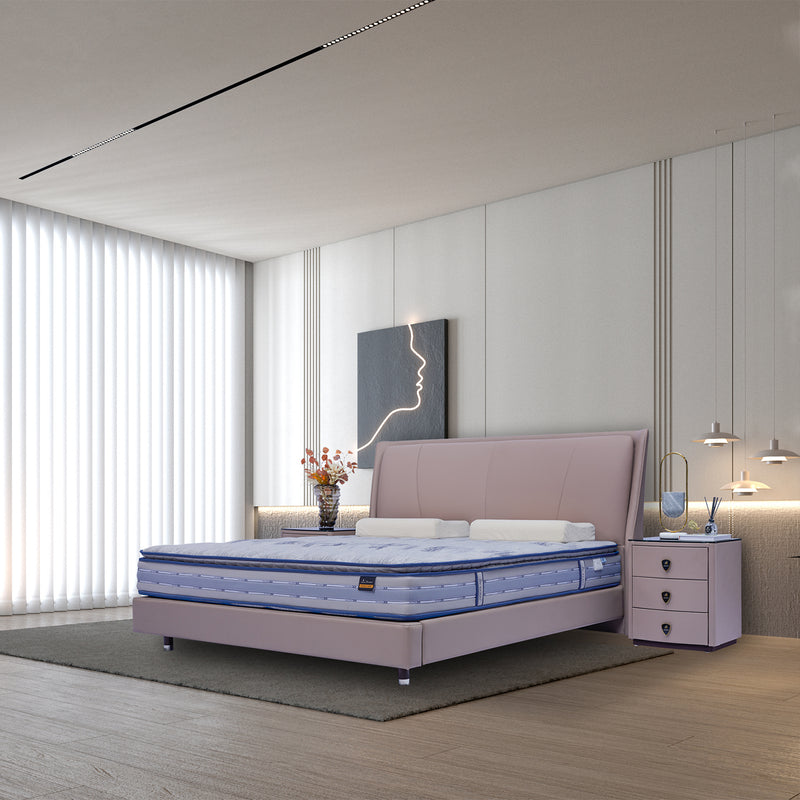 DeRUCCI Bed Frame BOC1 - 018 in a modern bedroom with light pink fabric, blue patterned mattress, white pillows, and matching nightstand with flowers and book. Minimalist decor with vertical blinds and modern art on the wall.