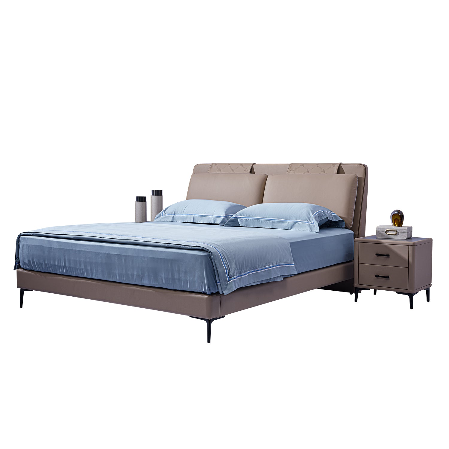 DeRUCCI bed frame model BOC1-006 upholstered in beige leather with light blue bedding, accompanied by a matching bedside table with drawers and decor.
