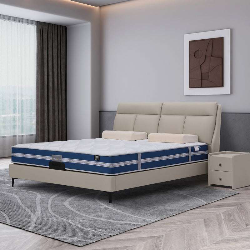 DeRUCCI bed frame BOC1 - 002 in beige leather with padded headboard and blue double-layer mattress. Matching beige nightstand and modern bedroom decor.