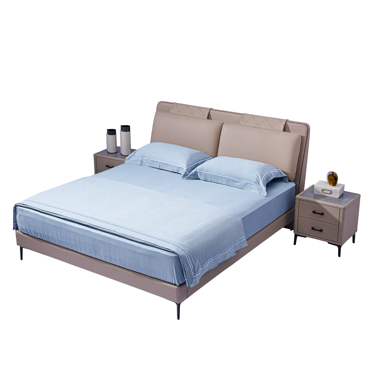 Modern taupe-colored bed frame with cushioned headboard and light blue bedding, flanked by matching bedside tables with drawers, books, and vases.