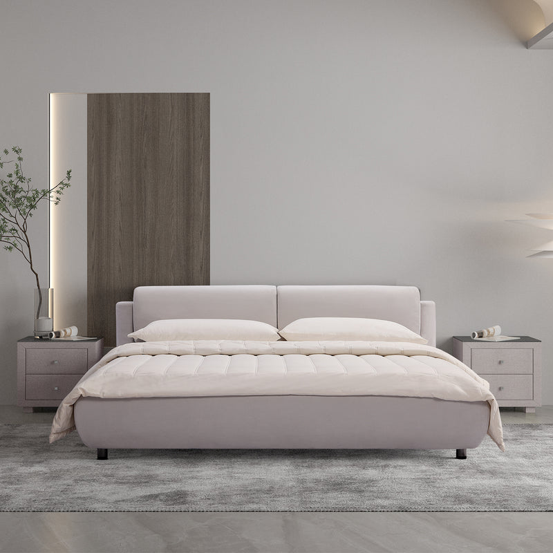 DeRUCCI Bed Frame BZZ4 - 082 in a modern bedroom setting, light-colored upholstered bed with sleek design, flanked by matching nightstands, and a wooden accent wall.