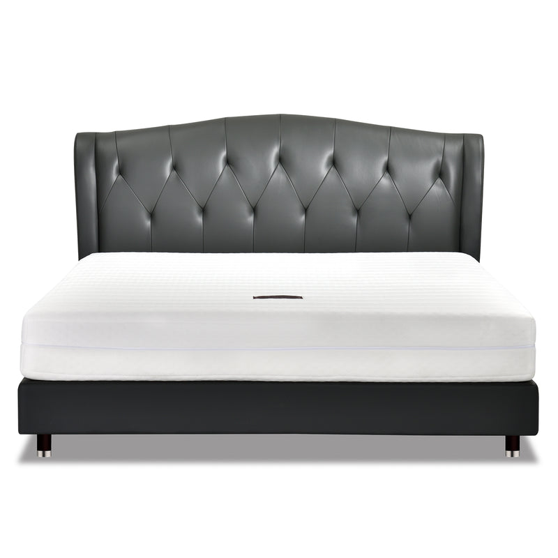 Black leather bed frame with diamond-tufted headboard and white mattress, modern and elegant design for contemporary bedroom.