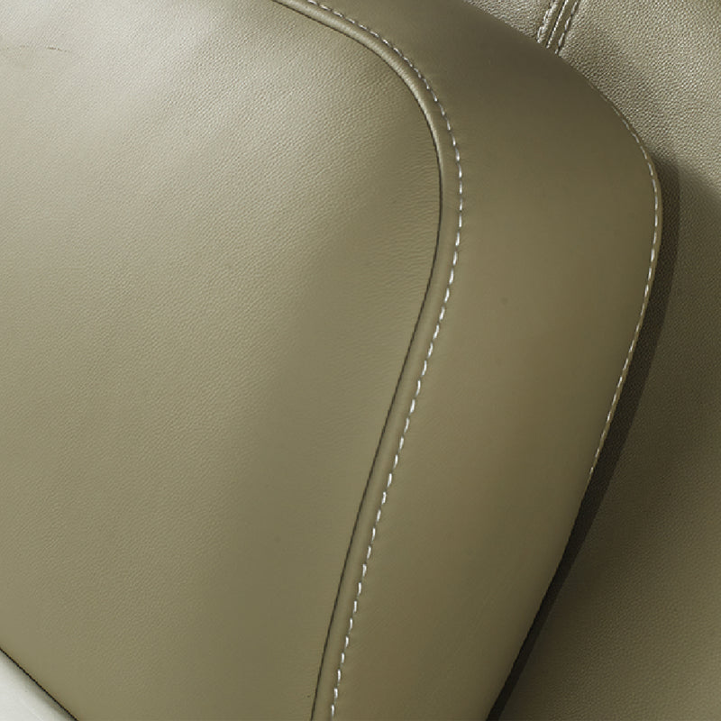 Close-up of beige leather bed frame headboard with detailed stitching, showcasing high-quality craftsmanship in DeRUCCI's bedroom furniture.