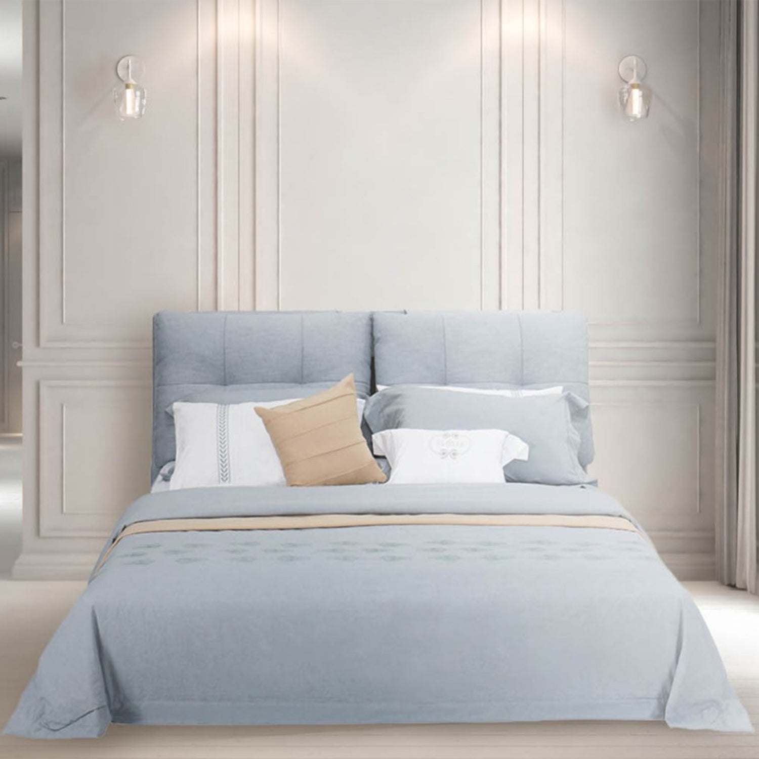 DeRUCCI Bed Frame BZZ4 - 285 with light blue and beige bedding and pillows, featuring a modern upholstered light blue headboard and white paneled wall background