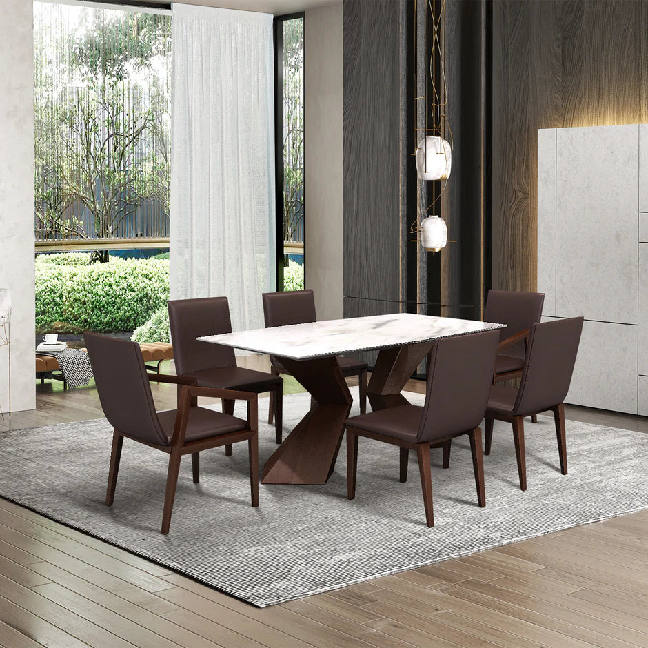 a marble-top dining table and four mahogany chairs