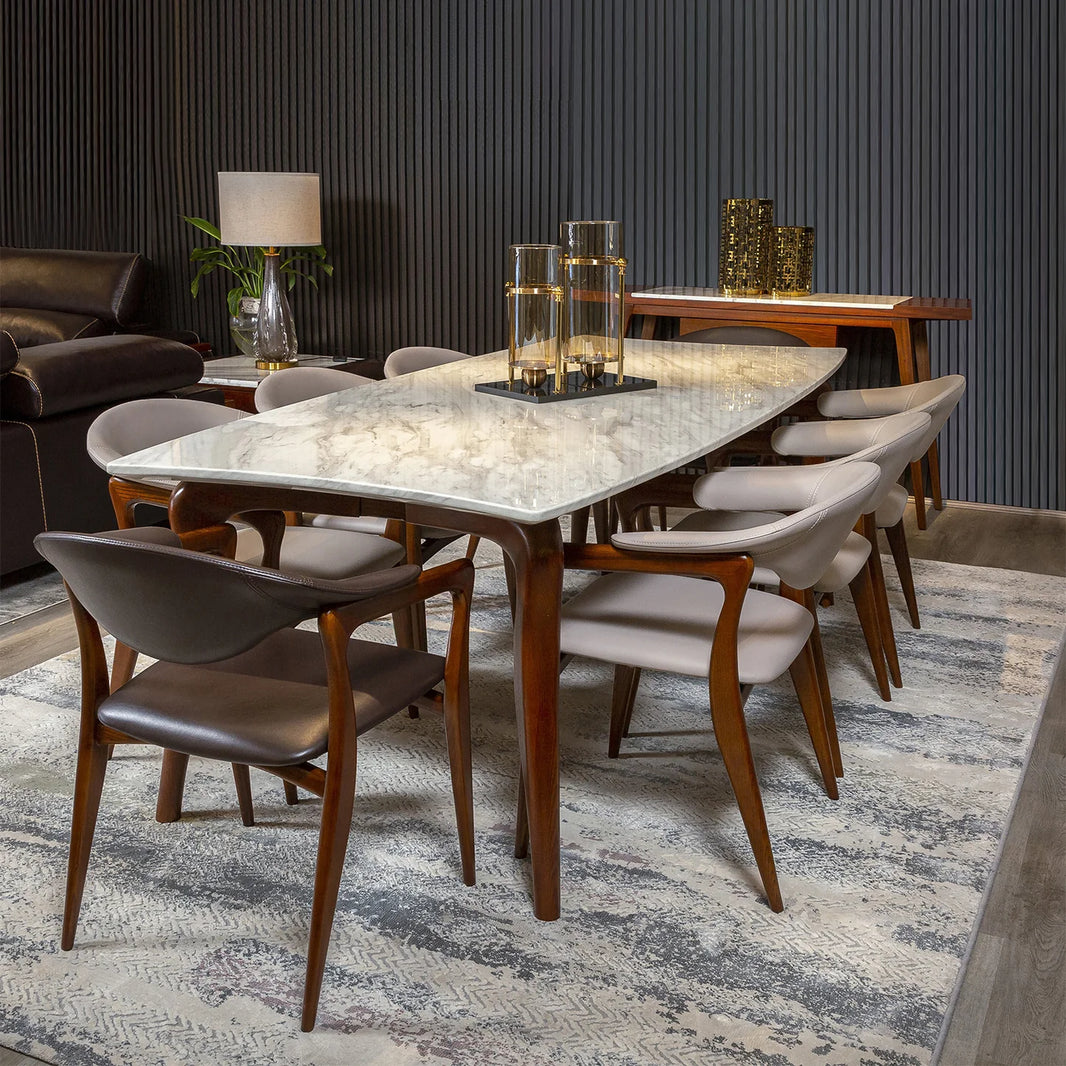 Modern dining room with a marble-top table and wooden chairs