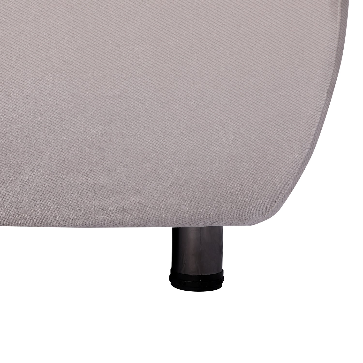 Close-up of bed frame leg, featuring light grey fabric and black cylindrical leg support. Modern minimalist design.