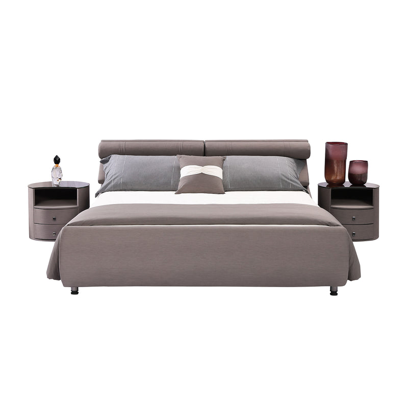 Modern gray fabric bed frame with cushioned headboard, flanked by nightstands with decorative items, styled in a sleek bedroom setting. DeRUCCI Bed Frame BZZ4 - 093C.