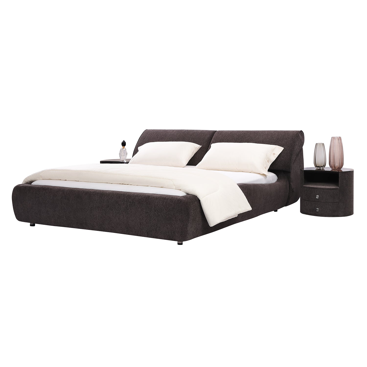 DeRUCCI Bed Frame BZZ4 - 117 with dark fabric, thick cushioned headboard, white bedding, and matching round nightstand with vases and lamp.