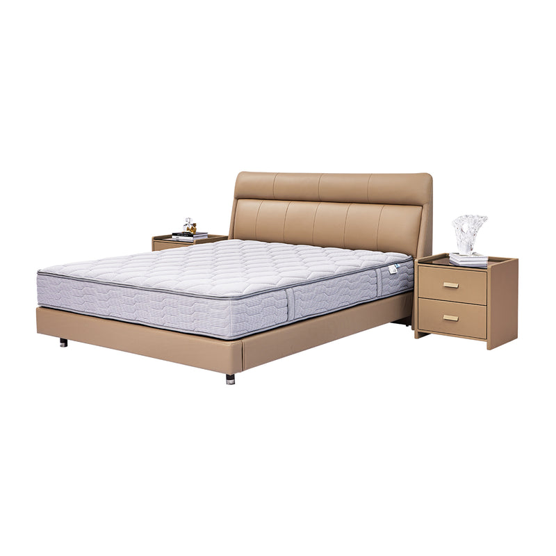 Light brown leather bed frame with padded headboard and neatly made white and gray mattress, flanked by two matching bedside tables with drawers, featuring a modern and stylish bedroom design.
