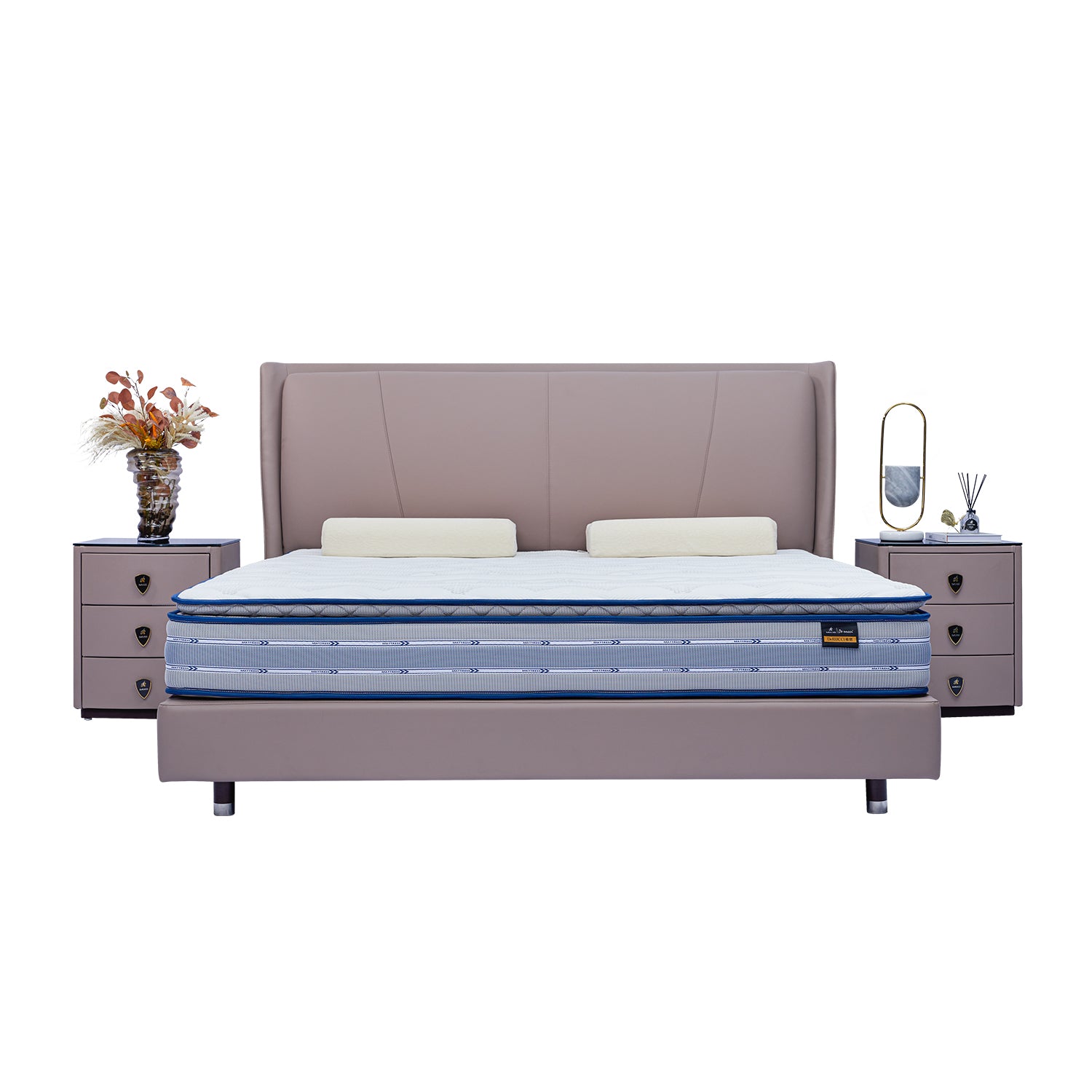 DeRUCCI Bed Frame BOC1 - 018 with a beige plush headboard and blue mattress, accompanied by two bedside tables with decorations including a vase, books, and a reed diffuser.