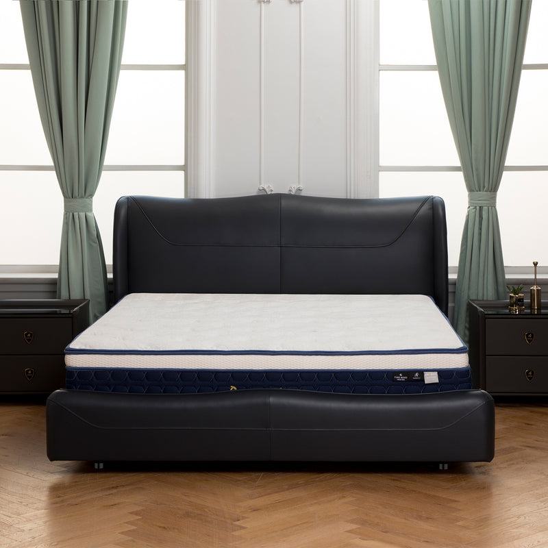 Deep sea blue bed frame BZZ4-201 from DeRUCCI with high elastic sponge footboard, flanked by dark wooden nightstands, light green curtains, and herringbone wooden floor.